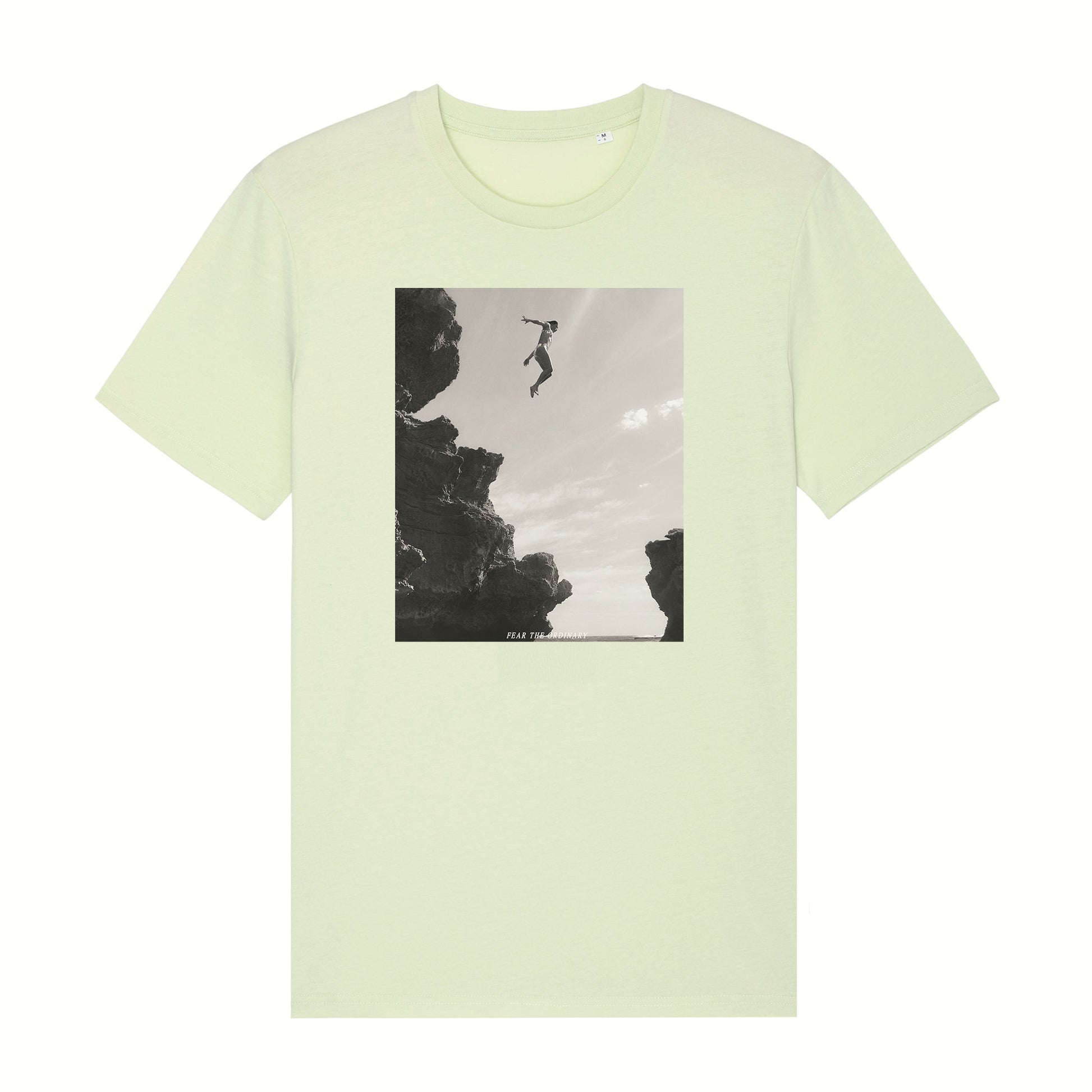 Fear The Ordinary light mint premium organic cotton t-shirt with black and white photo print of a girl jumping from a cliff.